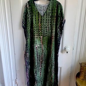 Green print caftan with side slits.